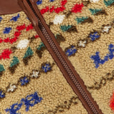 Ralph Lauren Polo Country Scenic Full Zip Fleece in tan, featuring a brown leather collar and zipper trim with a multi-colored geometric pattern.