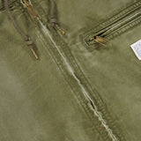 Close-up of the RALPH LAUREN POLO Denim Full-Zip Sherpa Long Sleeve Jacket in a grey-green wash, featuring sturdy metal zippers, adjustable drawstrings, and a small fabric tag on the pocket. The fabric shows gentle wear along the zipper seam, enhancing its subtle vintage denim appeal.