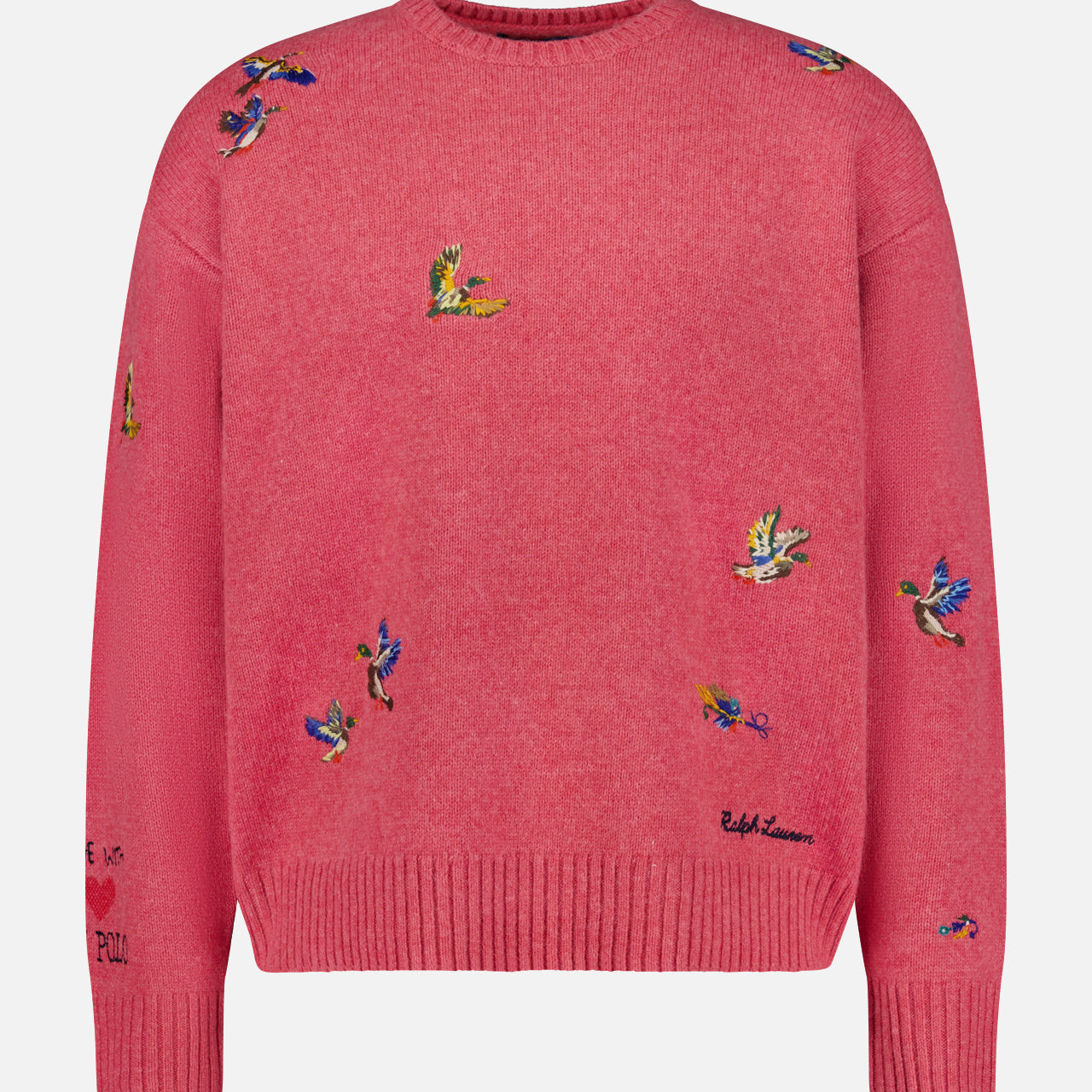 The Ducks Fly Crewneck Sweater by RALPH LAUREN POLO is a pink wool alpaca blend featuring vibrant embroidered ducks across the front, sleeves, and shoulders, complete with ribbed cuffs, hem, and a classic crew neckline for rustic charm.