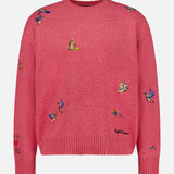The Ducks Fly Crewneck Sweater by RALPH LAUREN POLO is a pink wool alpaca blend featuring vibrant embroidered ducks across the front, sleeves, and shoulders, complete with ribbed cuffs, hem, and a classic crew neckline for rustic charm.