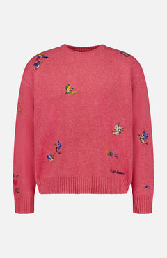 The Ducks Fly Crewneck Sweater by RALPH LAUREN POLO is a pink wool alpaca blend featuring vibrant embroidered ducks across the front, sleeves, and shoulders, complete with ribbed cuffs, hem, and a classic crew neckline for rustic charm.
