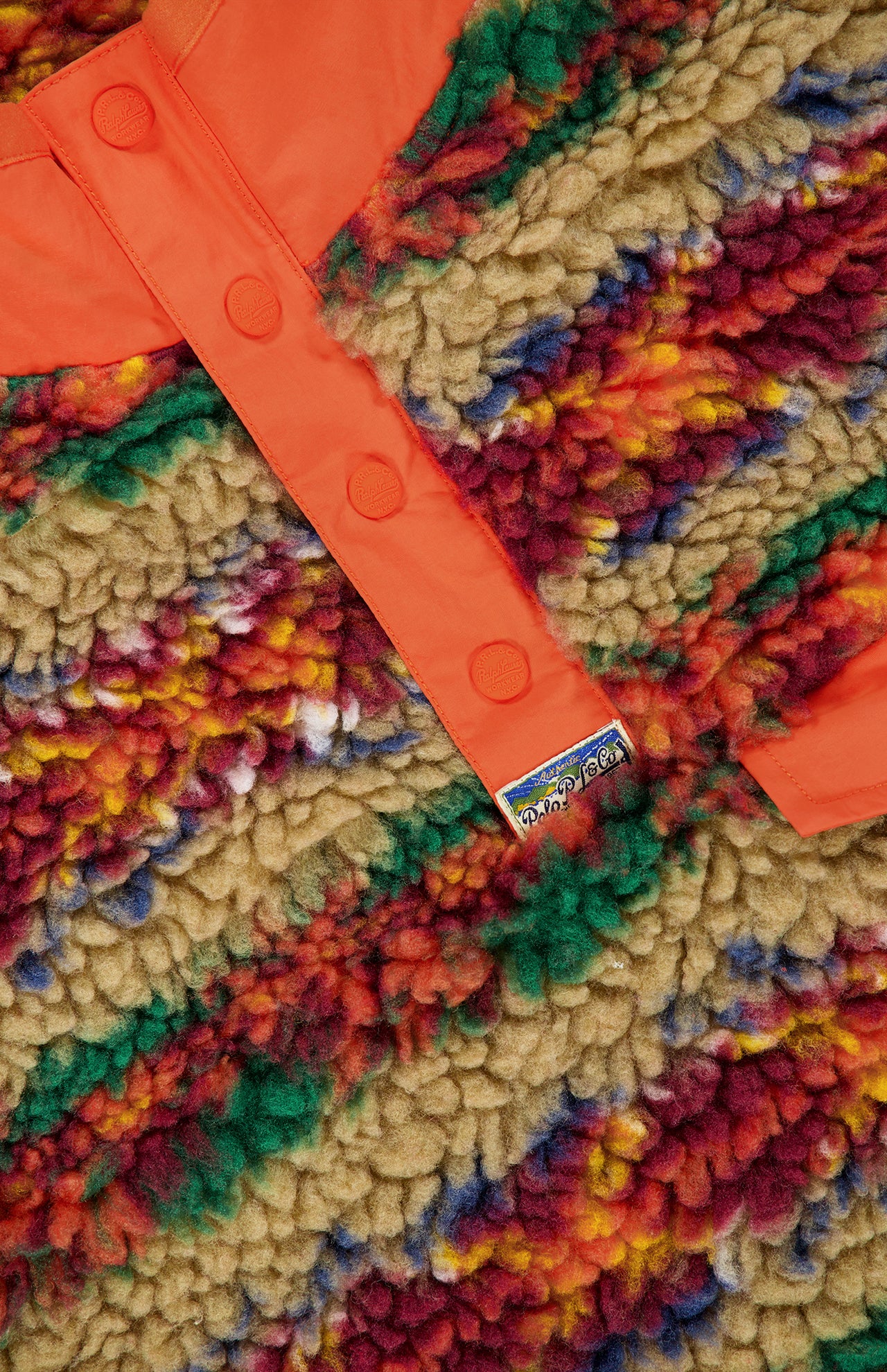 Ralph Lauren Polo Fairisle Snap Mockneck Pullover Sweater in a high-pile fleece with a snap-button placket and a multicolored Fair Isle print.