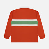 The RALPH LAUREN POLO Red Rocks Novelty Graphic Rugby Polo Shirt is a long-sleeve orange rugby shirt with a white collar and a horizontal green and white stripe across the back, displayed flat on a white background. Designed with an oversized fit for added comfort, this classic piece is finished with an embroidered Pony detail, adding a signature Ralph Lauren touch.