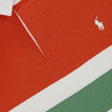 Close-up of the Red Rocks Novelty Graphic Rugby Polo Shirt by RALPH LAUREN POLO, featuring bold red, white, and green stripes, an oversized fit, a crisp white collar, and the brand’s signature embroidered Pony logo in white.