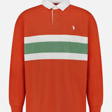 The Red Rocks Novelty Graphic Rugby Polo Shirt by RALPH LAUREN POLO is an oversized, long-sleeve shirt in vibrant orange with a classic white collar. It features bold horizontal green and white stripes across the chest and is finished with a small embroidered Pony logo on the left side, creating a relaxed, contemporary look.