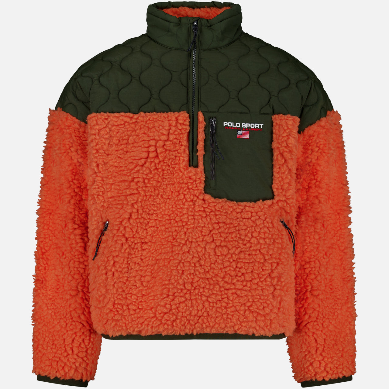 The Shaggy 1/2 Zip Polo Sport Mockneck Sweater by RALPH LAUREN POLO is a unisex fleece pullover featuring a textured orange sherpa body with olive green quilted fabric on the shoulders, collar, and chest pocket. This color-blocked half-zip design is completed with a zippered chest pocket highlighted by the distinctive Polo Sport logo.