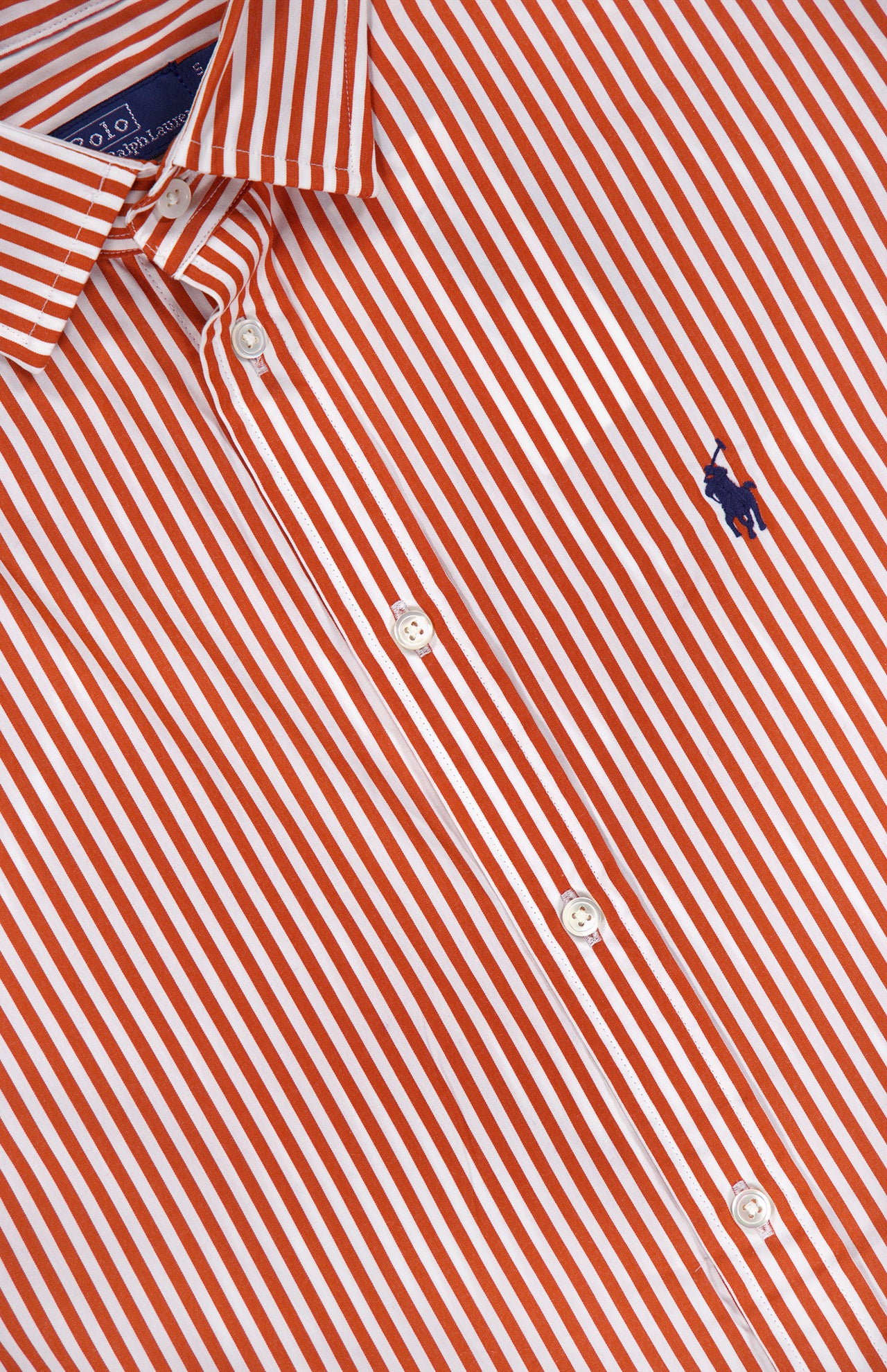 The Cotton Poplin Long Sleeve Blouse from RALPH LAUREN POLO is a relaxed-fit, red and white vertically striped cotton shirt with a collared button-down design featuring white buttons and a small dark blue embroidered Pony logo of a horse and rider on the chest.