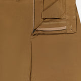 Close-up of brown Cotton Twill Flare Pants by RALPH LAUREN POLO, featuring a high-rise silhouette with the waistband, zipper, and button fly partially open to reveal the inside stitching and pocket lining. The pants are neatly pressed and laid flat.