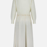 Back view of an off-white Italian carded-wool Crepe Woven Turtleneck A-Line Dress featuring a ribbed bodice and a gathered, A-line skirt.
