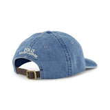 A blue denim RALPH LAUREN POLO Denim Sport Cap viewed from the back, featuring embroidered white text and an adjustable back strap with a brass buckle.