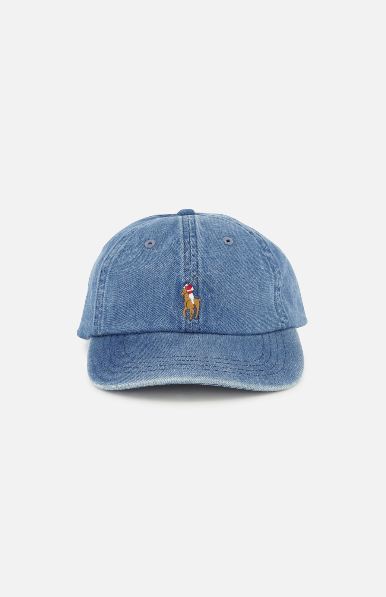 The RALPH LAUREN POLO Denim Sport Cap is a blue denim ball cap featuring a small, centered embroidered Pony logo of a person riding a horse above the brim. The cap includes an adjustable back strap and is displayed against a plain white background.