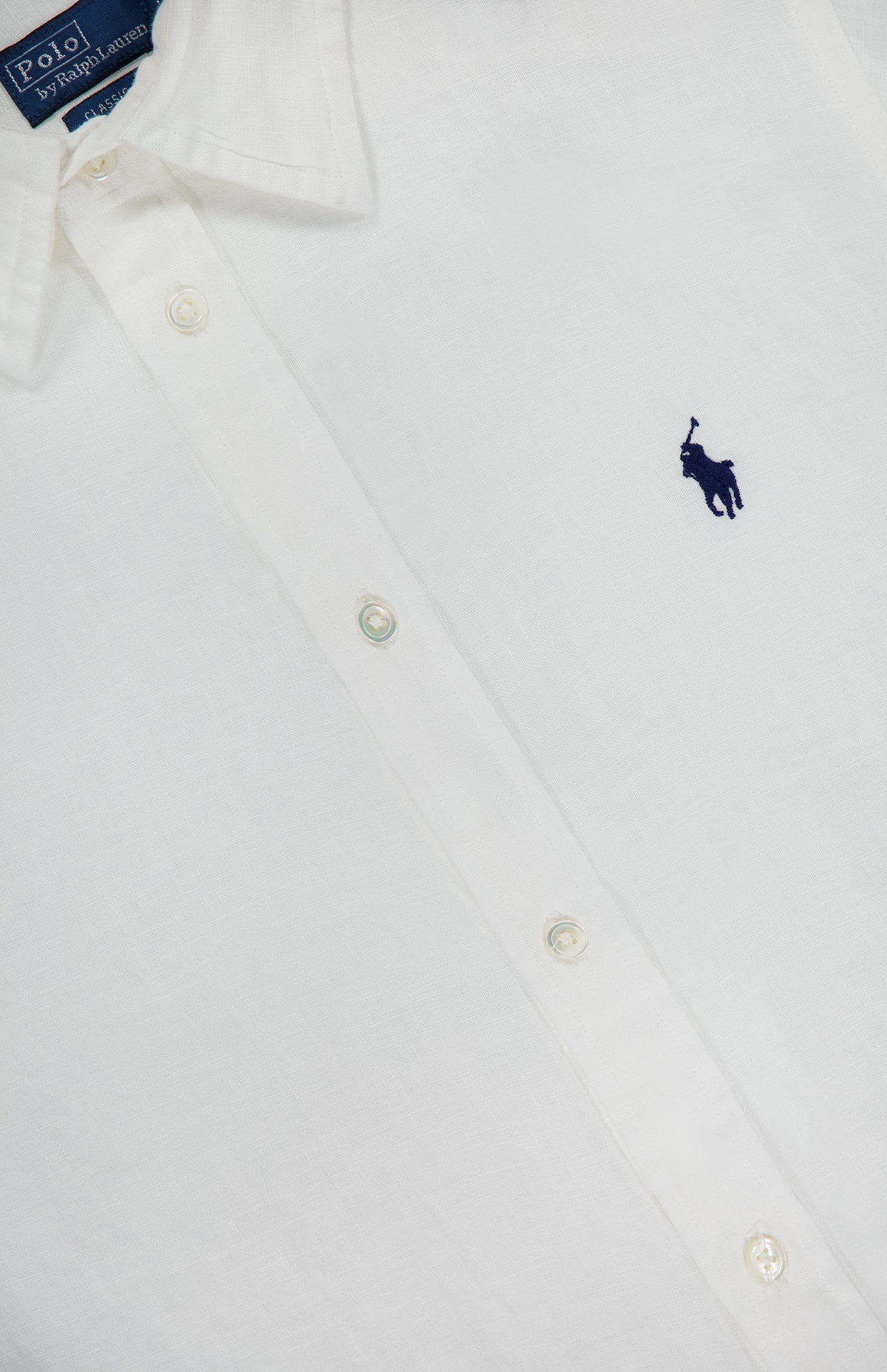 A white Linen Long Sleeve Button Front Shirt by RALPH LAUREN POLO, featuring the signature navy blue embroidered polo player logo on the chest.
