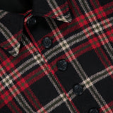 Close-up of a Ralph Lauren Polo Plaid Wool Blend Jacket in black, red, and cream, featuring a collar and a row of black buttons.