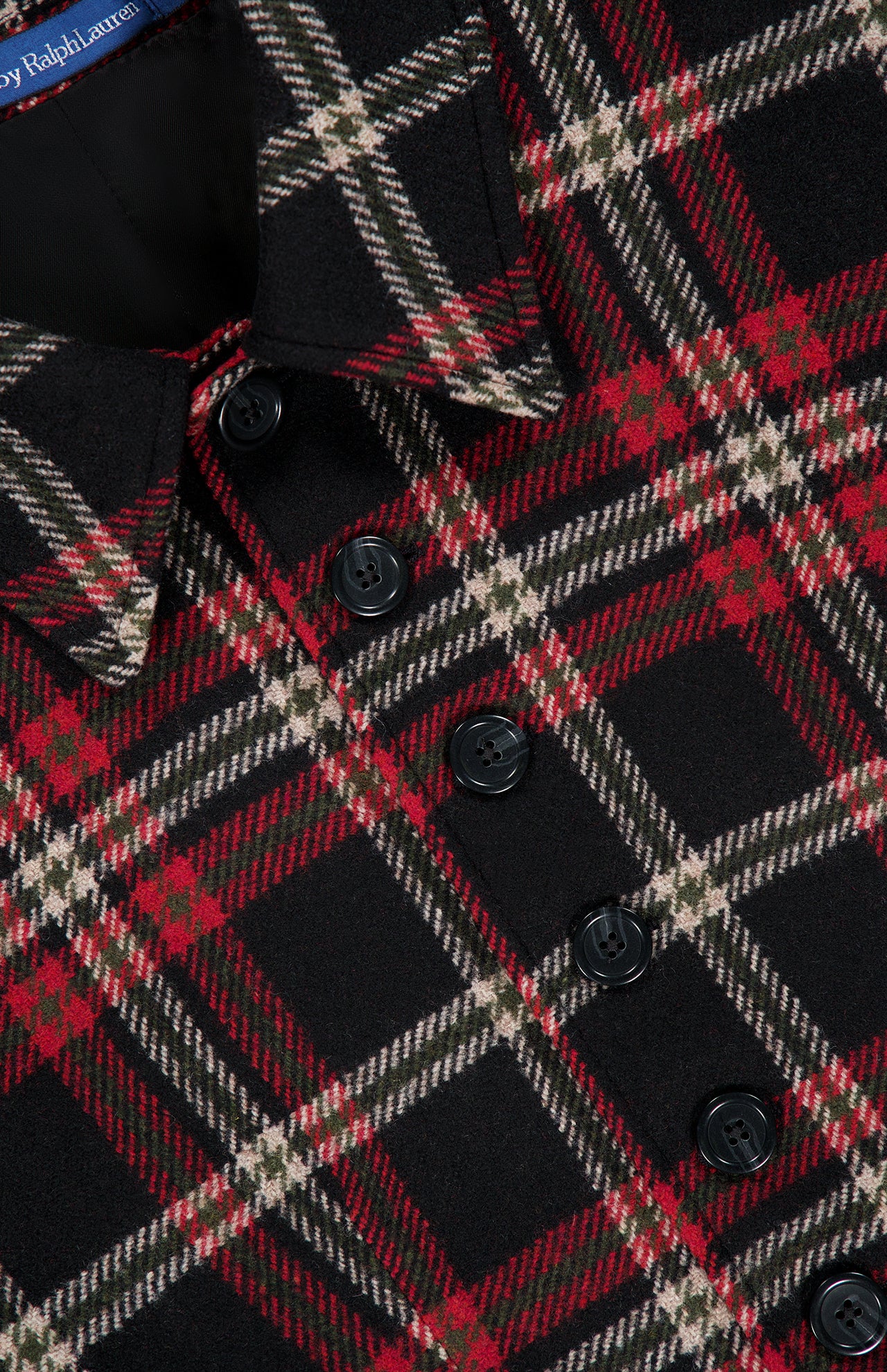 Close-up of a Ralph Lauren Polo Plaid Wool Blend Jacket in black, red, and cream, featuring a collar and a row of black buttons.