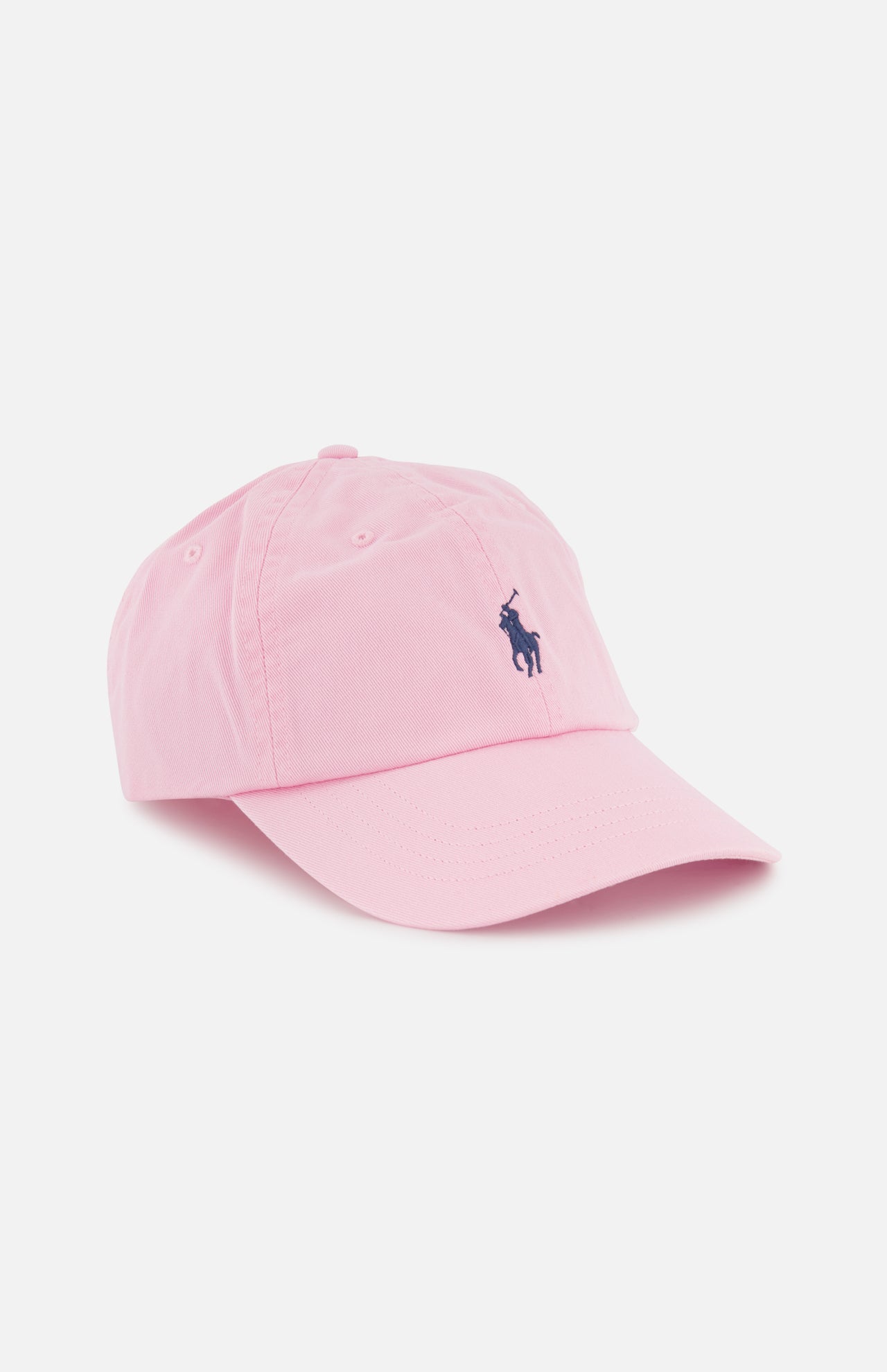 The RALPH LAUREN POLO Twill Logo Cap is a light pink cotton chino cap with a curved brim and an embroidered Pony logo on the front, shown against a white background.