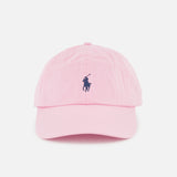 The Twill Logo Cap by RALPH LAUREN POLO is a light pink cotton chino ball cap with a curved brim, featuring a small navy embroidered Polo Pony logo on the front and shown against a plain white background.