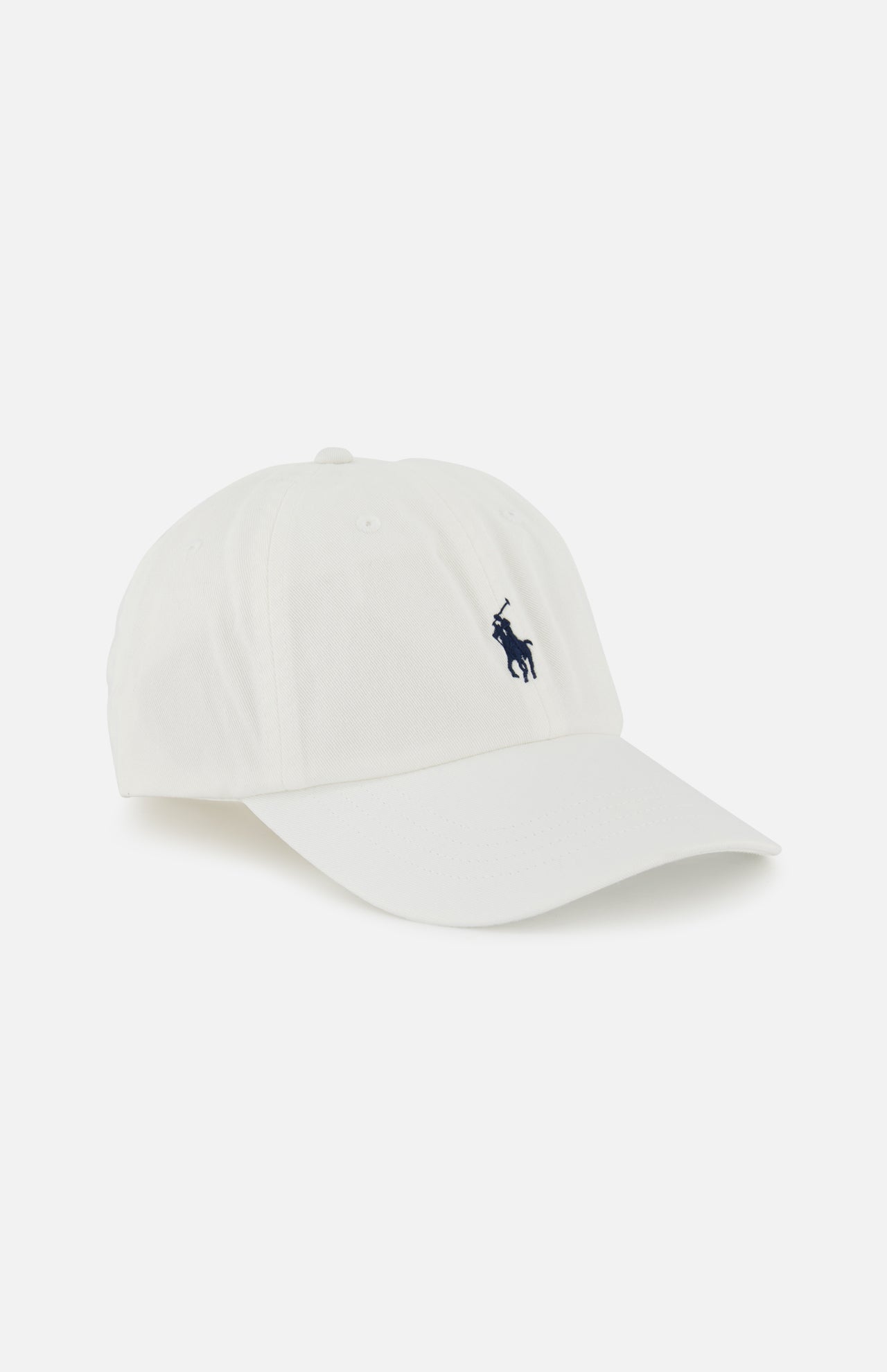 The Twill Logo Cap by RALPH LAUREN POLO is a classic white cotton chino cap, featuring a small navy polo player logo embroidered on the front left side.