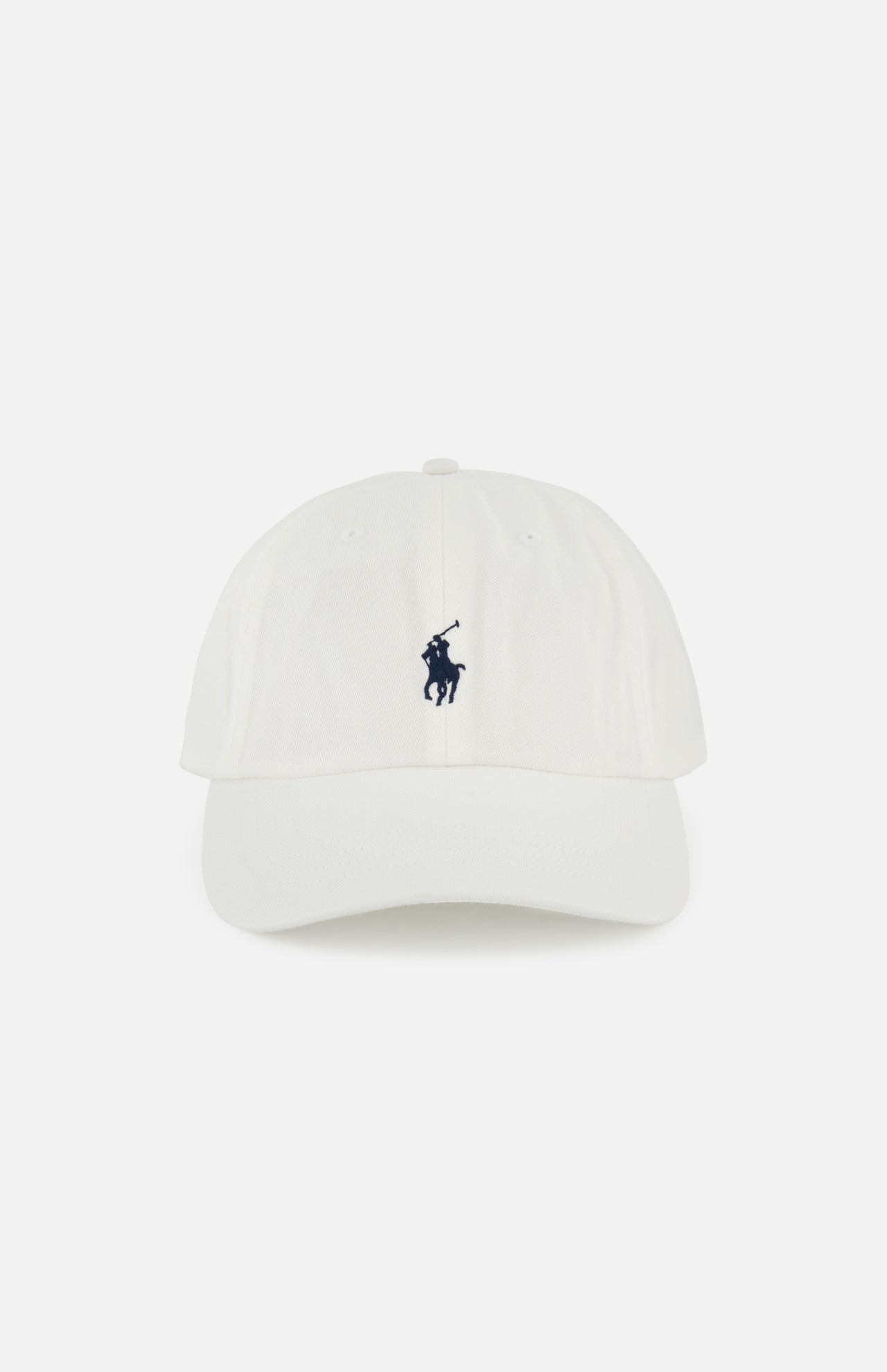 The Twill Logo Cap by RALPH LAUREN POLO is a classic white cotton chino hat with a curved brim and visible stitching, featuring a navy embroidered Polo player logo on the front.
