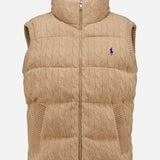 Wool Cashmere Sweater Vest by RALPH LAUREN POLO featuring a tan cable-knit design with a high collar, front zipper, and two side pockets. Finished with an embroidered blue Pony on the left chest.