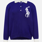Introducing the Wool Long Sleeve Polo Collar Sweater by RALPH LAUREN POLO: a royal blue knit sweater inspired by the classic rugby shirt, featuring long sleeves, white cuffs, a white polo collar, and three buttons. The left chest showcases a large, white stitched polo player logo for Ralph Lauren’s signature touch.