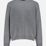 The Herringbone Textured Crewneck Sweater by RALPH LAUREN PURPLE LABEL features a gray cashmere knit with a subtle herringbone pattern, ribbed cuffs, hem, and neckline. Made in Italy and shown against a white background.