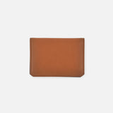 The Burnish Calf Wallet from RALPH LAUREN PURPLE LABEL, crafted in brown calfskin with a simple rectangular design, lies flat on a plain white background, showcasing a timeless accessory that embodies understated elegance.