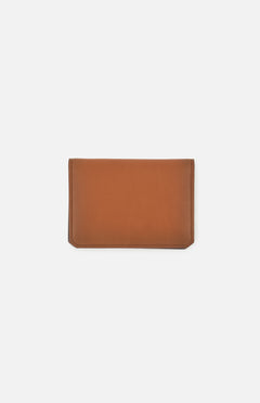 The Burnish Calf Wallet from RALPH LAUREN PURPLE LABEL, crafted in brown calfskin with a simple rectangular design, lies flat on a plain white background, showcasing a timeless accessory that embodies understated elegance.