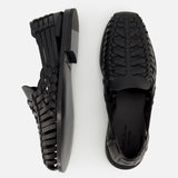 Two Burnished Vacchetta Casual Loafers by RALPH LAUREN PURPLE LABEL, made in Italy, are displayed on a light background—one top view and one side view—showcasing their refined design and elegant slip-on silhouette.