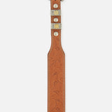 Ralph Lauren Purple Label Western Vacchetta Belt in tan floral-embossed leather featuring intricate metal hardware, an ornate silver and gold-tone buckle, and decorative metal accents.