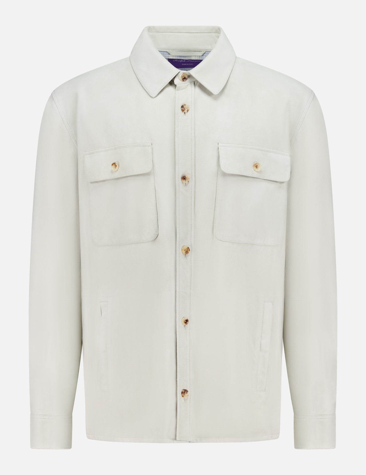 The Calloway Suede Knit Overshirt by RALPH LAUREN PURPLE LABEL is a light beige shirt jacket featuring a collar, two chest flap pockets with buttons, and two vertical side pockets. Displayed on a plain white background, this piece exemplifies exceptional Italian craftsmanship.
