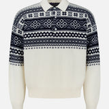 Introducing the Cash Holiday Pattern Polo Sweater by RALPH LAUREN PURPLE LABEL: expertly crafted in Italy from luxurious cashmere, this cream sweater showcases a sophisticated navy blue Fair Isle pattern across the chest, shoulders, and sleeves. The design is finished with a refined collar, long ribbed cuffs, and elegant Mother of Pearl buttons for an elevated touch.