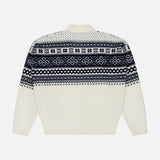 The Cash Holiday Pattern Polo Sweater by RALPH LAUREN PURPLE LABEL, shown laid flat on a plain background, is a white sweater featuring navy blue and black geometric and snowflake patterns across the chest, back, and sleeves. Inspired by Italian-made cashmere designs, this piece showcases refined details that evoke the classic elegance of traditional cashmere polo shirts for an elevated winter style.