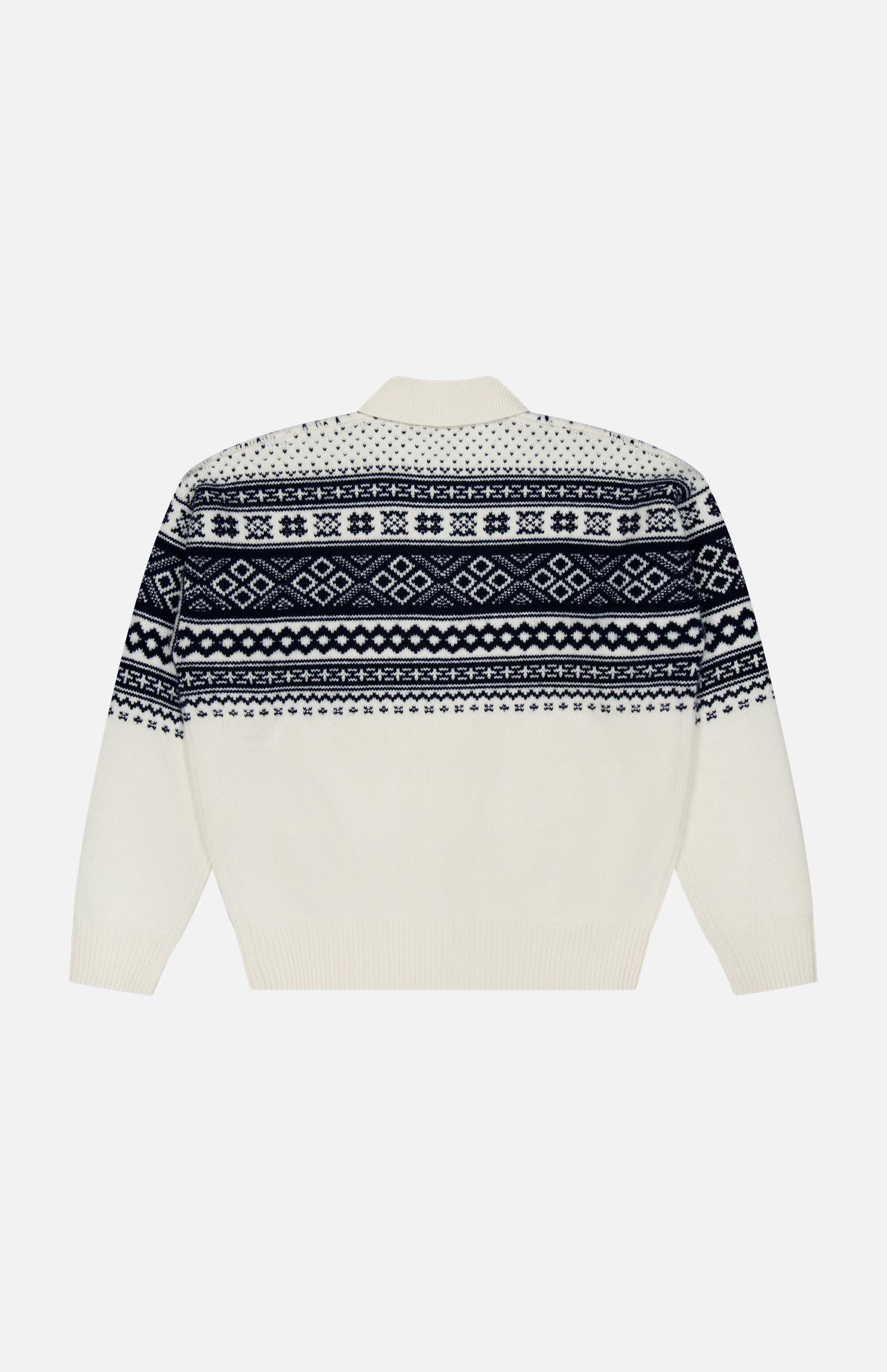 The Cash Holiday Pattern Polo Sweater by RALPH LAUREN PURPLE LABEL, shown laid flat on a plain background, is a white sweater featuring navy blue and black geometric and snowflake patterns across the chest, back, and sleeves. Inspired by Italian-made cashmere designs, this piece showcases refined details that evoke the classic elegance of traditional cashmere polo shirts for an elevated winter style.