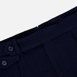 Close-up of the waistband of the RALPH LAUREN PURPLE LABEL Cashmere Herringbone Pleated Tennis Short in dark blue, featuring two buttons and a belt loop detail, set against a plain white background.