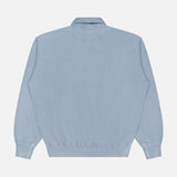 The RALPH LAUREN PURPLE LABEL Cashmere Long Sleeve Quarter Zip Polo Sweatshirt is shown from the back in light blue, featuring a collared neckline, ribbed cuffs and waistband, and a simple, minimal design against a plain white background.