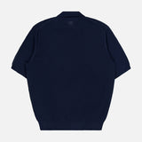 A navy blue Cotton Short Sleeve Polo Pullover Sweater by RALPH LAUREN PURPLE LABEL is displayed from the back, highlighting a subtle textured pattern and a small logo near the neckline. Expertly crafted in Italy, this piece blends understated elegance with superior craftsmanship.