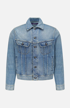 The Lux Italian Denim Trucker Jacket by RALPH LAUREN PURPLE LABEL features light blue Japanese denim with metal buttons, front chest pockets with flaps, side pockets, and visible seams. Showcasing a subtle vintage fade, this Purple Label jacket is displayed against a plain white background.