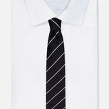A neatly folded white dress shirt with a RALPH LAUREN PURPLE LABEL Faille Stripe Silk Tie, crafted in Italy, featuring thin diagonal white stripes, displayed on a plain white background.