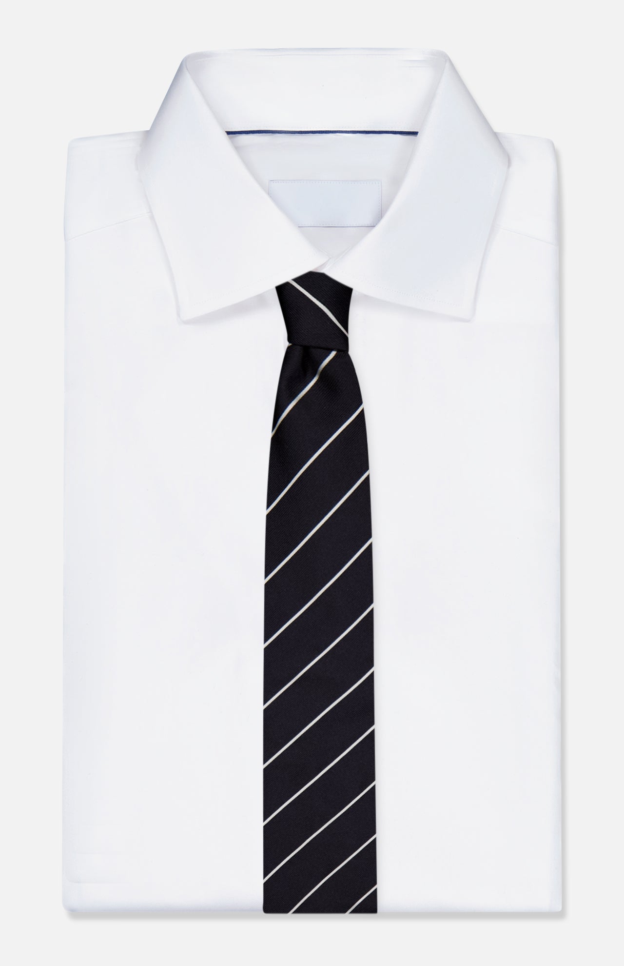 A neatly folded white dress shirt with a RALPH LAUREN PURPLE LABEL Faille Stripe Silk Tie, crafted in Italy, featuring thin diagonal white stripes, displayed on a plain white background.