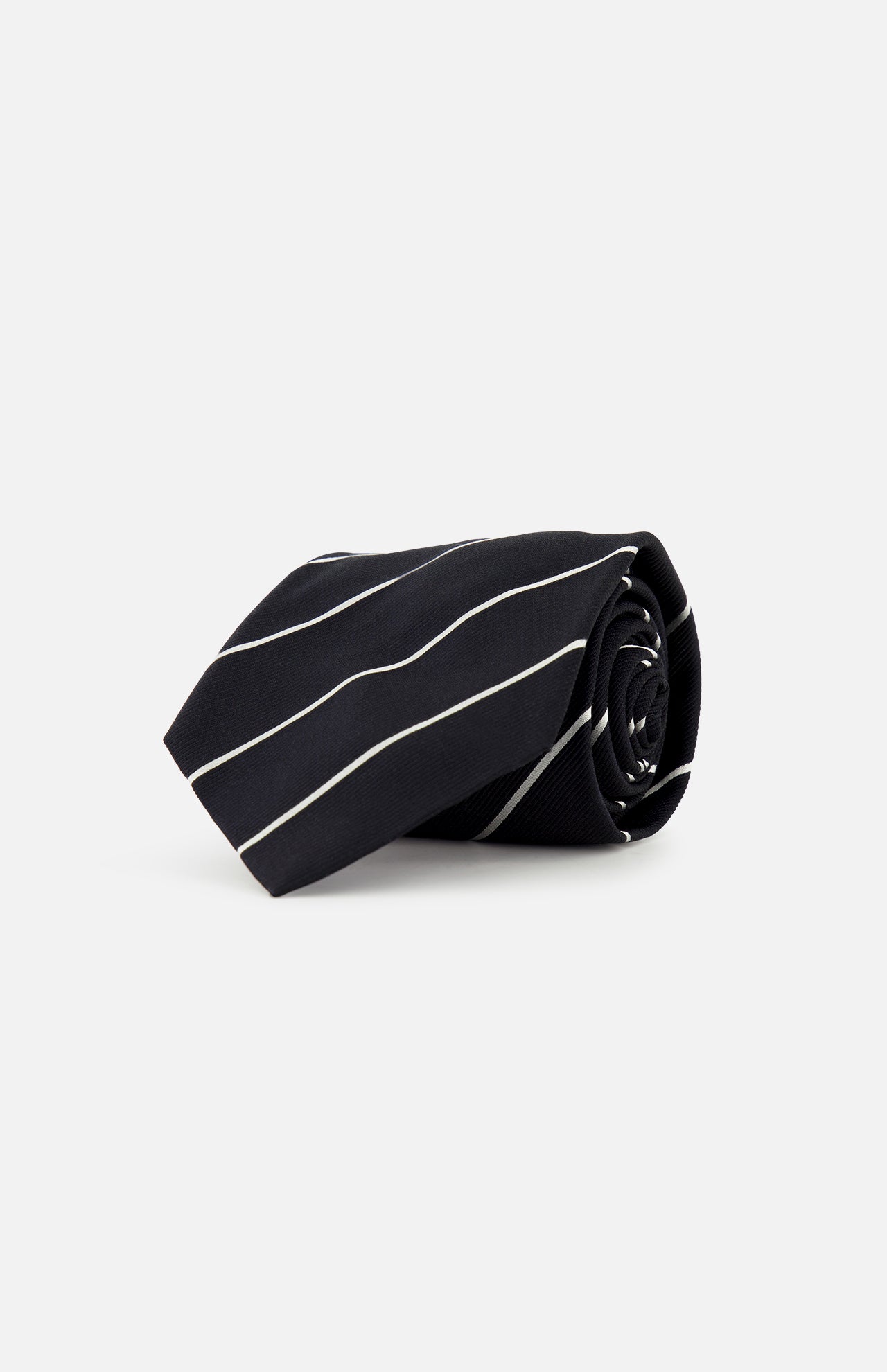 The Faille Stripe Silk Tie by RALPH LAUREN PURPLE LABEL, crafted in Italy from black silk with thin diagonal white stripes, is shown rolled up against a plain white background.