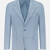 The Garment Dyed Cotton Single Breasted Sportcoat by RALPH LAUREN PURPLE LABEL is a light blue men’s blazer featuring notch lapels, a single button closure, and three front pockets. Hand tailored in Italy from premium stretch chino fabric for comfort and vintage character, it is displayed on a white background.