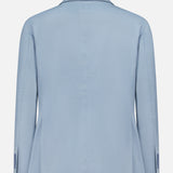 A light blue Garment Dyed Cotton Single Breasted Sportcoat by RALPH LAUREN PURPLE LABEL, shown from the back, features long sleeves, a notched collar, and buttoned cuffs. The smooth, slightly lustrous cotton fabric lends vintage character to its modern silhouette.