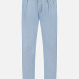 The Garment Dyed Cotton Trouser Pant by RALPH LAUREN PURPLE LABEL features a light blue hue, high waist, and tapered legs, crafted from stretch chino fabric for enhanced comfort, displayed against a white background.
