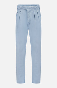 The Garment Dyed Cotton Trouser Pant by RALPH LAUREN PURPLE LABEL features a light blue hue, high waist, and tapered legs, crafted from stretch chino fabric for enhanced comfort, displayed against a white background.