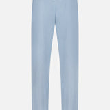 The Garment Dyed Cotton Trouser Pant from RALPH LAUREN PURPLE LABEL is shown in light blue and viewed from the back, highlighting two rear pockets—one with a buttoned flap and one without. Expertly crafted from stretch chino fabric, these trousers provide a tailored fit and a smooth, refined finish.