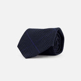 A navy and black Glenplaid Check Woven Tie by RALPH LAUREN PURPLE LABEL, rolled up on a white background.