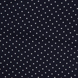Crafted from luxurious silk, the Silk Foulard Dot Pocket Square by RALPH LAUREN PURPLE LABEL features a classic navy blue background adorned with evenly spaced small white polka dots. A visible crease adds character to the fabric, while "Ralph" appears partially in elegant white script at the bottom right corner—a refined signature of Purple Label craftsmanship. Made in Italy, this pocket square offers timeless style and exceptional quality.