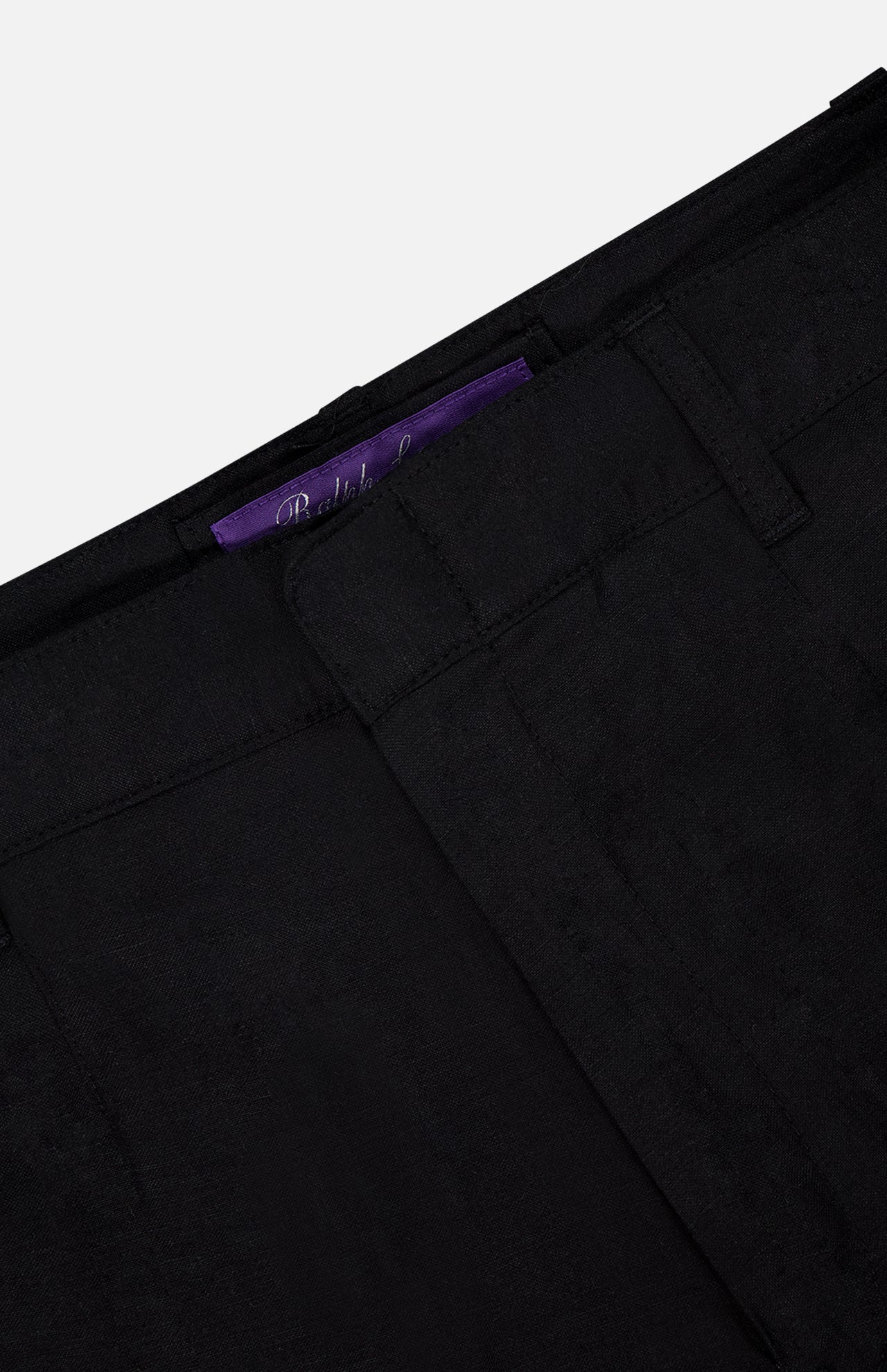 Close-up of RALPH LAUREN PURPLE LABEL Silk Linen Cargo Trousers in black, featuring belt loops and a partially visible purple label inside the waistband, expertly crafted from a silk linen blend.