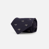 RALPH LAUREN PURPLE LABEL Silk Martini Convo Tie, a rolled-up dark navy silk tie featuring a repeating pattern of small martini glasses.
