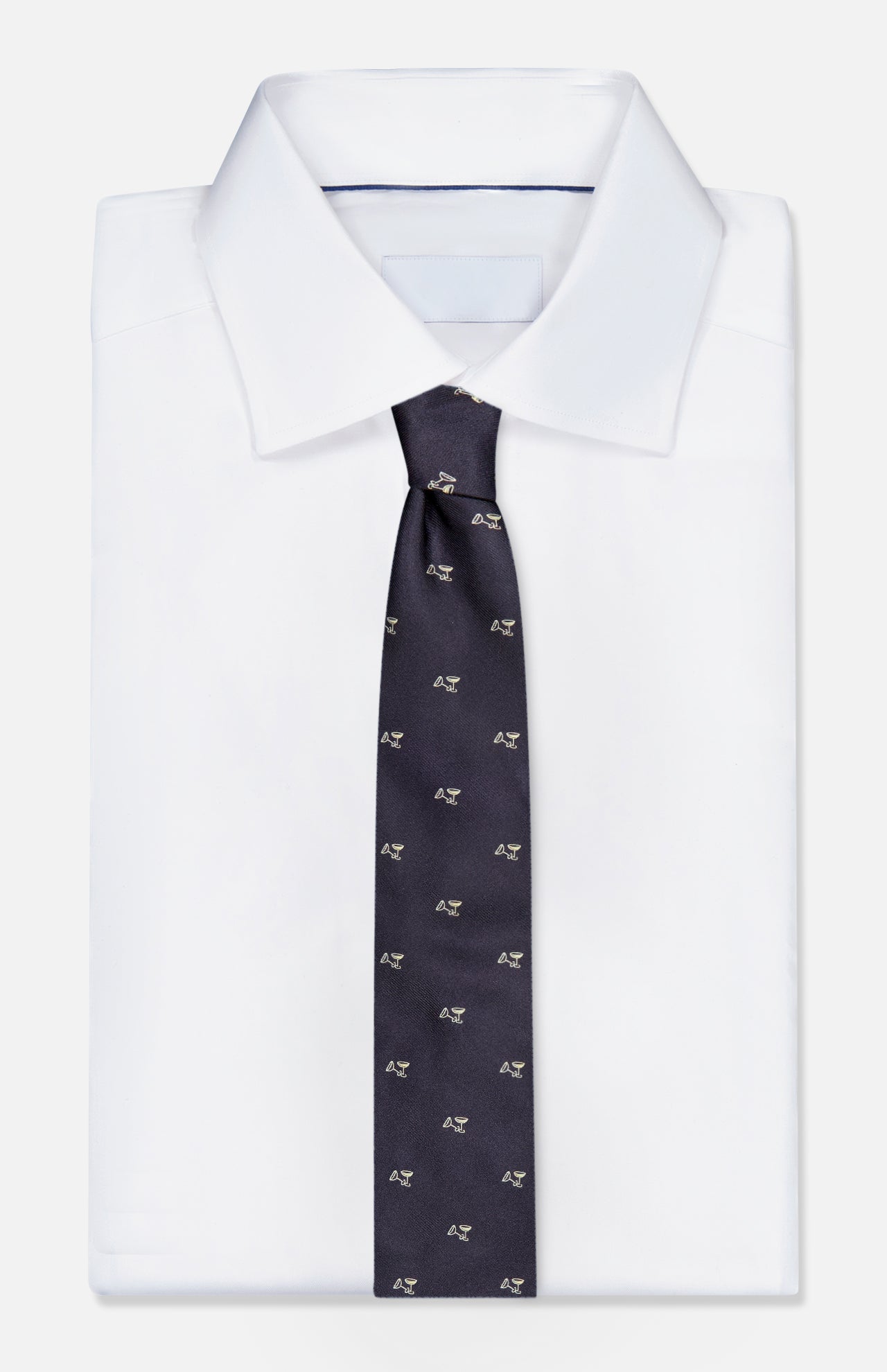 RALPH LAUREN PURPLE LABEL Silk Martini Convo Tie in dark navy silk with a repeating pattern of small martini glasses, worn with a white collared dress shirt.